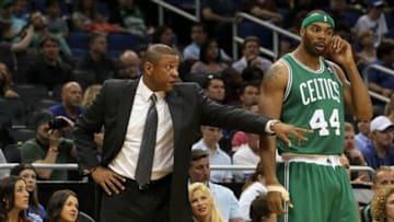 Apr 13, 2013; Orlando, FL, USA; Boston Celtics head coach Doc Rivers talks with power forward Chris Wilcox (44) during the first quarter against the Orlando Magic at the Amway Center. Mandatory Credit: Kim Klement-USA TODAY Sports