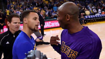 OAKLAND, CA - NOVEMBER 24: Stephen Curry #30 of the Golden State Warriors meets at center court with Kobe Bryant #24 of the Los Angeles Laker prior to the start of their NBA basketball game at ORACLE Arena on November 24, 2015 in Oakland, California. NOTE TO USER: User expressly acknowledges and agrees that, by downloading and or using this photograph, User is consenting to the terms and conditions of the Getty Images License Agreement. (Photo by Thearon W. Henderson/Getty Images)