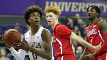 SEATTLE, WASHINGTON - JANUARY 30: Jaden McDaniels #0 of the Washington Huskies works towards the basket against Nico Mannion #1 of the Arizona Wildcats in the first half at Hec Edmundson Pavilion on January 30, 2020 in Seattle, Washington. (Photo by Abbie Parr/Getty Images)