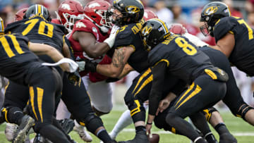 LITTLE ROCK, AR - NOVEMBER 29: Connor Bazelak #8 of the Missouri Tigers fumbles the snap during a game against the Arkansas Razorbacks at War Memorial Stadium on November 29, 2019 in Little Rock, Arkansas The Tigers defeated the Razorbacks 24-14. (Photo by Wesley Hitt/Getty Images)