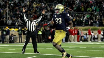 SOUTH BEND, IN - OCTOBER 28: Josh Adams #33 of the Notre Dame Fighting Irish scores a touchdown in the third quarter against the North Carolina State Wolfpack at Notre Dame Stadium on October 28, 2017 in South Bend, Indiana. (Photo by Dylan Buell/Getty Images)