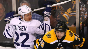 BOSTON, MA - APRIL 21: Boston Bruins Jake DeBrusk, right, collides along the boards with Toronto Maple Leafs Nikita Zaitsev, left, during the first period. The Boston Bruins host the Toronto Maple Leafs in Game 5 of the Eastern Conference First Round during the 2018 NHL Stanley Cup Playoffs at the TD Garden in Boston on April 21, 2018. (Photo by John Tlumacki/The Boston Globe via Getty Images)