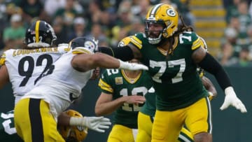Green Bay Packers offensive tackle Billy Turner (77) creates a hole for running back Aaron Jones during the third quarter of their game Sunday, October 3, 2021 at Lambeau Field in Green Bay, Wis. Green Bay Packers beat the Pittsburgh Steelers 27-17.Packers04 35