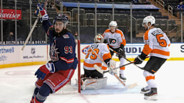 NEW YORK, NEW YORK - MARCH 17: Mika Zibanejad #93 of the New York Rangers celebrates his power-play goal at 14:29 of the second period against Carter Hart #79 of the Philadelphia Flyers at Madison Square Garden on March 17, 2021 in New York City. The Rangers shutout the Flyers 9-0. (Photo by Bruce Bennett/Getty Images)
