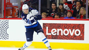 Nov 20, 2016; Raleigh, NC, USA; Winnipeg Jets forward Patrik Laine (29) takes a third period shot against the Carolina Hurricanes at PNC Arena. The Carolina Hurricanes defeated the Winnipeg Jets 3-1. Mandatory Credit: James Guillory-USA TODAY Sports