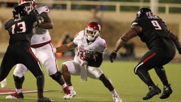 Oct 22, 2016; Lubbock, TX, USA; Oklahoma Sooners running back Joe Mixon (25) looks for running room against the Texas Tech Red Raiders in the first half at Jones AT&T Stadium. Mandatory Credit: Michael C. Johnson-USA TODAY Sports