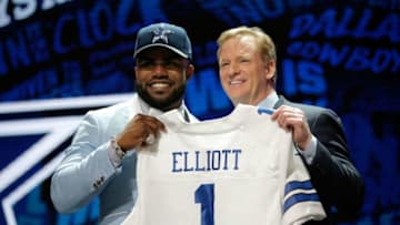 CHICAGO, IL - APRIL 28: (L-R) Ezekiel Elliott of Ohio State holds up a jersey with NFL Commissioner Roger Goodell after being picked #4 overall by the Dallas Cowboys during the first round of the 2016 NFL Draft at the Auditorium Theatre of Roosevelt University on April 28, 2016 in Chicago, Illinois. (Photo by Jon Durr/Getty Images)