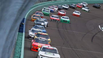 HOMESTEAD, FL - NOVEMBER 17: Tyler Reddick, driver of the #9 BurgerFi Chevrolet, leads a pack of cars during the NASCAR Xfinity Series Ford EcoBoost 300 at Homestead-Miami Speedway on November 17, 2018 in Homestead, Florida. (Photo by Sean Gardner/Getty Images)