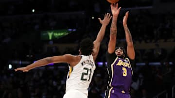 LOS ANGELES, CALIFORNIA - FEBRUARY 16: Anthony Davis #3 of the Los Angeles Lakers shoots a three point basket against Hassan Whiteside #21 of the Utah Jazz during the second quarter at Crypto.com Arena on February 16, 2022 in Los Angeles, California. NOTE TO USER: User expressly acknowledges and agrees that, by downloading and or using this Photograph, user is consenting to the terms and conditions of the Getty Images License Agreement. (Photo by Katelyn Mulcahy/Getty Images)