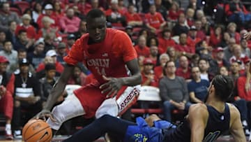 LAS VEGAS, NV - FEBRUARY 28: Cheikh Mbacke Diong #34 of the UNLV Rebels is called for an offensive charge as he runs into Caleb Martin #10 of the Nevada Wolf Pack during their game at the Thomas & Mack Center on February 28, 2018 in Las Vegas, Nevada. (Photo by Ethan Miller/Getty Images)