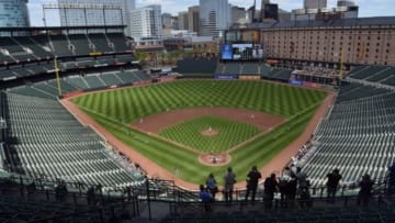Apr 29, 2015; Baltimore, MD, USA; Members of the media take photos of first inning action of the game between Chicago White Sox and Baltimore Orioles at Oriole Park at Camden Yards. Fans are not allowed to attend the game do to the current state of unrest in Baltimore. Mandatory Credit: Tommy Gilligan-USA TODAY Sports