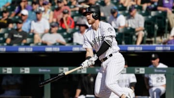 Jun 9, 2016; Denver, CO, USA; Colorado Rockies shortstop Trevor Story (27) hits a single in the fifth inning against the Pittsburgh Pirates at Coors Field. Mandatory Credit: Isaiah J. Downing-USA TODAY Sports