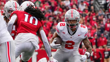 Nov 4, 2023; Piscataway, New Jersey, USA; Ohio State Buckeyes wide receiver Emeka Egbuka (2) looks for room to run after making a catch during the second half of the NCAA football game against the Rutgers Scarlet Knights at SHI Stadium. Ohio State won 35-16.