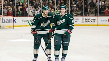 Mar 29, 2016; Saint Paul, MN, USA; Minnesota Wild forward Erik Haula (56) celebrates his goal with forward Nino Niederreiter (22) during a game between the Minnesota Wild and Chicago Blackhawks at Xcel Energy Center. The Wild defeated the Blackhawks 4-1. Mandatory Credit: Brace Hemmelgarn-USA TODAY Sports