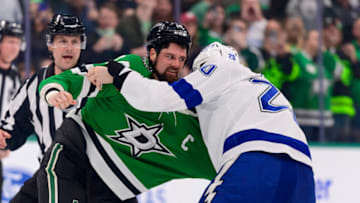 Apr 12, 2022; Dallas, Texas, USA; Dallas Stars left wing Jamie Benn (14) fights with Tampa Bay Lightning left wing Nicholas Paul (20) during the first period at the American Airlines Center. Mandatory Credit: Jerome Miron-USA TODAY Sports