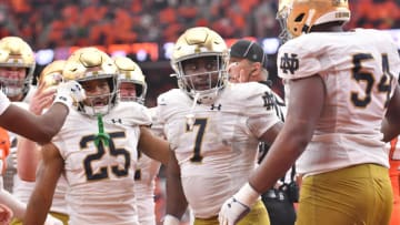 Oct 29, 2022; Syracuse, New York, USA; Notre Dame Fighting Irish running back Audric Estime (7) celebrates his rushing touchdown against the Syracuse Orange with running back Chris Tyree (25) and offensive lineman Blake Fisher (54) in the fourth quarter at JMA Wireless Dome. Mandatory Credit: Mark Konezny-USA TODAY Sports