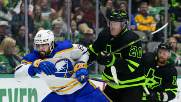 Feb 27, 2022; Dallas, Texas, USA; Dallas Stars defenseman Ryan Suter (20) checks Buffalo Sabres right wing Alex Tuch (89) during the third period at the American Airlines Center. Mandatory Credit: Jerome Miron-USA TODAY Sports