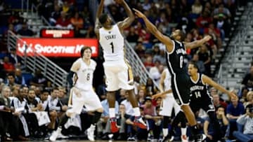 Mar 24, 2014; New Orleans, LA, USA; New Orleans Pelicans forward Tyreke Evans (1) shoots over Brooklyn Nets guard Deron Williams (8) during the second half of a game at the Smoothie King Center. The Pelicans defeated the Nets 109-104 in overtime. Mandatory Credit: Derick E. Hingle-USA TODAY Sports