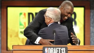 Jun 27, 2013; Brooklyn, NY, USA; NBA commissioner David Stern (front) gets a hug from former NBA player Hakeem Olajuwon after the first round of the 2013 NBA Draft at the Barclays Center. Mandatory Credit: Joe Camporeale-USA TODAY Sports