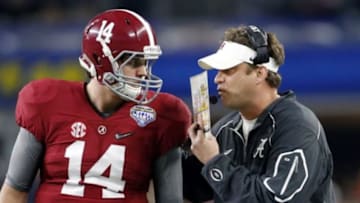 Dec 31, 2015; Arlington, TX, USA; Alabama Crimson Tide quarterback Jake Coker (14) talks with offensive coordinator Lane Kiffin in the first half against the Michigan State Spartans in the 2015 CFP semifinal at the Cotton Bowl at AT&T Stadium. Mandatory Credit: Matthew Emmons-USA TODAY Sports
