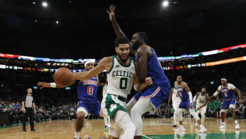 Dec 17, 2021; Boston, Massachusetts, USA; Boston Celtics forward Jayson Tatum (0) is stopped by Golden State Warriors forward Draymond Green (23) during the second half at TD Garden. Mandatory Credit: Winslow Townson-USA TODAY Sports