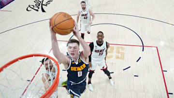 Jun 4, 2023; Denver, CO, USA; Jun 4, 2023; Denver, CO, USA; Denver Nuggets guard Christian Braun (0) dunks against the Miami Heat during the first half in game two of the 2023 NBA Finals at Ball Arena. Mandatory Credit: Mark J. Terrill/Pool Photo-USA TODAY Sports