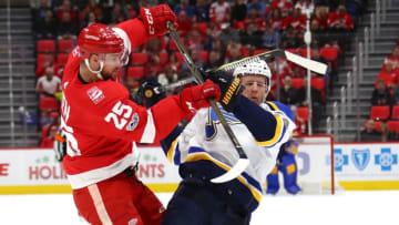 DETROIT, MI - DECEMBER 09: Mike Green #25 of the Detroit Red Wings lays a first period hit on Carl Gunnarsson #4 of the St. Louis Blues at Little Caesars Arena on December 9, 2017 in Detroit, Michigan. (Photo by Gregory Shamus/Getty Images)