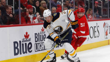 Jan 12, 2020; Detroit, Michigan, USA; Buffalo Sabres right wing Kyle Okposo (21) skates with the puck defended by Detroit Red Wings center Valtteri Filppula (51) in the first period at Little Caesars Arena. Mandatory Credit: Rick Osentoski-USA TODAY Sports