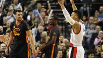 Feb 19, 2016; Portland, OR, USA; Portland Trail Blazers guard Damian Lillard (0) reacts after hitting a three point shot during the third quarter of the game against the Golden State Warriors at the Moda Center at the Rose Quarter. Lillard scored 51 points as the Blazers won the game 137-105. Mandatory Credit: Steve Dykes-USA TODAY Sports