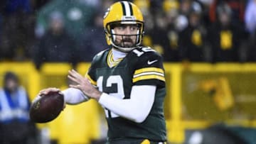 Nov 26, 2015; Green Bay, WI, USA; Green Bay Packers quarterback Aaron Rodgers (12) drops back to pass against the Chicago Bears during the second half for a NFL game on Thanksgiving at Lambeau Field. The Bears defeat the Packers 17-13. Mandatory Credit: Mike DiNovo-USA TODAY Sports