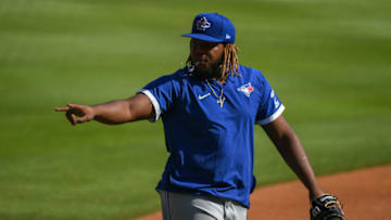 Aug 4, 2020; Cumberland, Georgia, USA; Toronto Blue Jays third baseman Vladimir Guerrero Jr. (27) signals to the cutout crowd before the game against Atlanta Braves at Truist Park. Mandatory Credit: Adam Hagy-USA TODAY Sports