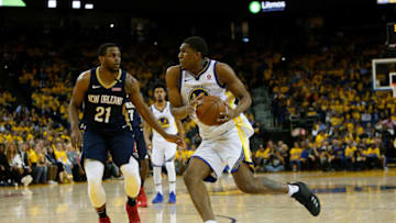 OAKLAND, CA - APRIL 28: Kevon Looney #5 of the Golden State Warriors drives to the basket against Darius Miller #21 of the New Orleans Pelicans during Game One of the Western Conference Semifinals at ORACLE Arena on April 28, 2018 in Oakland, California. NOTE TO USER: User expressly acknowledges and agrees that, by downloading and or using this photograph, User is consenting to the terms and conditions of the Getty Images License Agreement. (Photo by Lachlan Cunningham/Getty Images)