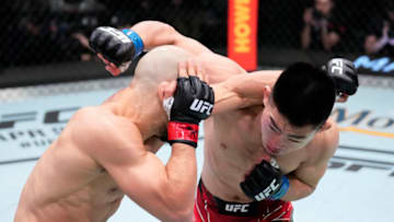 LAS VEGAS, NEVADA - MARCH 12: (R-L) Song Yadong of China and Marlon Moraes of Brazil trade punches in their bantamweight fight during the UFC Fight Night event at UFC APEX on March 12, 2022 in Las Vegas, Nevada. (Photo by Chris Unger/Zuffa LLC)