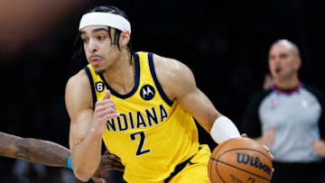 Mar 20, 2023; Charlotte, North Carolina, USA; Indiana Pacers guard Andrew Nembhard (2) drives to the basket against the Charlotte Hornets during the first half at Spectrum Center. Mandatory Credit: Nell Redmond-USA TODAY Sports