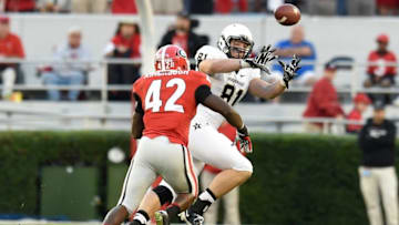 Oct 4, 2014; Athens, GA, USA; Vanderbilt Commodores tight end Steven Scheu (81) catches a pass behind Georgia Bulldogs linebacker Tim Kimbrough (42) during the second half at Sanford Stadium. Georgia defeated Vanderbilt 44-17. Mandatory Credit: Dale Zanine-USA TODAY Sports