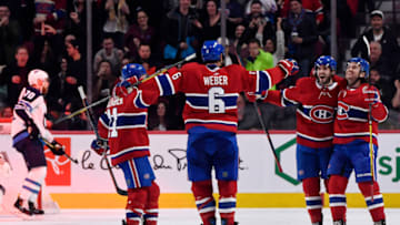 Feb 7, 2019; Montreal, Quebec, CAN; Montreal Canadiens defenseman Shea Weber (6) celebrates with Jonathan Drouin (92) and Brendan Gallagher (11) and Phillip Danault (24) after scoring a goal against the Winnipeg Jets during the third period at the Bell Centre. Mandatory Credit: Eric Bolte-USA TODAY Sports