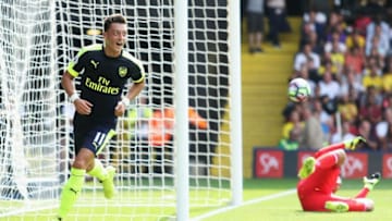 WATFORD, ENGLAND - AUGUST 27: Mesut Ozil of Arsenal scores his sides third goal during the Premier League match between Watford and Arsenal at Vicarage Road on August 27, 2016 in Watford, England. (Photo by Christopher Lee/Getty Images)