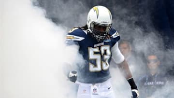 Dec 16, 2012; San Diego, CA, USA; San Diego Chargers inside linebacker Gary Guyton runs out of the smoke during pregame introduction before a game against the Carolina Panthers at Qualcomm Stadium. Mandatory Credit: Jake Roth-USA TODAY Sports