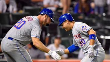 CHICAGO, IL - JULY 30: New York Mets first baseman Pete Alonso (20) congratulates New York Mets center fielder Michael Conforto (30) for his solo home run in the 11th inning against the Chicago White Sox on July 30, 2019 at Guaranteed Rate Field in Chicago, Illinois. (Photo by Quinn Harris/Icon Sportswire via Getty Images)
