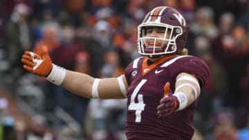 BLACKSBURG, VA - NOVEMBER 23: Linebacker Dax Hollifield #4 of the Virginia Tech Hokies reacts following a defensive stop against the Virginia Cavaliers in the first half at Lane Stadium on November 23, 2018 in Blacksburg, Virginia. (Photo by Michael Shroyer/Getty Images)