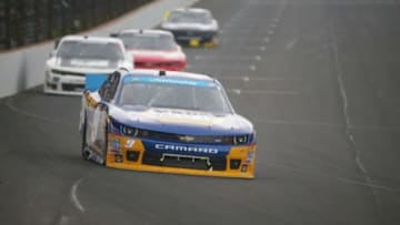 Jul 26, 2014; Indianapolis, IN, USA; NASCAR Nationwide Series driver Chase Elliott drives down the front stretch during the Indiana 250 at Indianapolis Motor Speedway. Mandatory Credit: Brian Spurlock-USA TODAY Sports