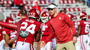Nov 20, 2021; Norman, Oklahoma, USA; Oklahoma Sooners head coach Lincoln Riley greets running back Marcus Major (24) before the game against the Iowa State Cyclones at Gaylord Family-Oklahoma Memorial Stadium. Mandatory Credit: Kevin Jairaj-USA TODAY Sports
