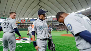 TOKYO, JAPAN - MARCH 21: Ichiro Suzuki #51 of the Seattle Marines is greeted by teammate Dee Gordon #9 after being taken out for a defensive replacement during the game against the Oakland Athletics during the 2019 Opening Series at the Tokyo Dome on Thursday, March 21, 2019 in Tokyo, Japan. (Photo by Yuki Taguchi/MLB Photos via Getty Images)
