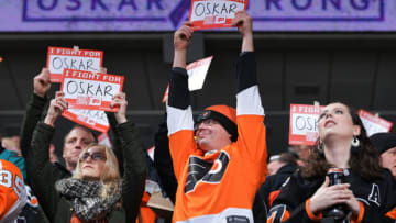 PHILADELPHIA, PA - DECEMBER 17: Fans hold up signs in support of Oskar Lindblom #23 of the Philadelphia Flyers who was recently diagnosed with Ewing sarcoma, a rare form of bone cancer, during a stoppage in play in the first period against the Anaheim Ducks on December 17, 2019 at the Wells Fargo Center in Philadelphia, Pennsylvania. (Photo by Drew Hallowell/Getty Images)