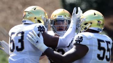 WINSTON SALEM, NC - SEPTEMBER 22: Drue Tranquill #23 celebrates with teammates Khalid Kareem #53 and Jonathan Bonner #55 of the Notre Dame Fighting Irish after a sack against the Wake Forest Demon Deacons during their game at BB&T Field on September 22, 2018 in Winston Salem, North Carolina. (Photo by Streeter Lecka/Getty Images)
