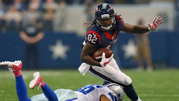 ARLINGTON, TX - OCTOBER 05: Keshawn Martin #82 of the Houston Texans breaks the tackle attempt bby Sterling Moore #26 of the Dallas Cowboys in the second half at AT&T Stadium on October 5, 2014 in Arlington, Texas. (Photo by Tom Pennington/Getty Images)