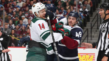 DENVER, COLORADO - OCTOBER 05: Samuel Girard #49 of the Colorado Avalanche shoves back and forth with Joel Eriksson Ek #14 of the Minnesota Wild at Pepsi Center on October 05, 2019 in Denver, Colorado. (Photo by Michael Martin/NHLI via Getty Images)