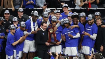 SAN FRANCISCO, CALIFORNIA - MARCH 26: The Duke Blue Devils pose for photos holding the regional champion trophy after defeating the Arkansas Razorbacks 78-69 in the NCAA Men's Basketball Tournament Elite 8 Round at Chase Center on March 26, 2022 in San Francisco, California. (Photo by Ezra Shaw/Getty Images)