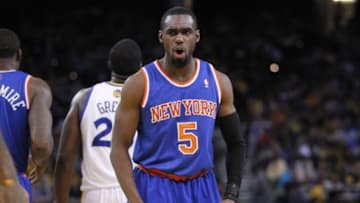 Mar 30, 2014; Oakland, CA, USA; New York Knicks guard Tim Hardaway Jr. (5) reacts against the Golden State Warriors in the fourth quarter at Oracle Arena. The Knicks won 89-84. Mandatory Credit: Cary Edmondson-USA TODAY Sports