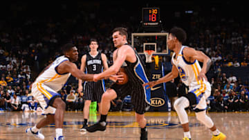 OAKLAND, CA - MARCH 16: Mario Hezonja #8 of the Orlando Magic dribbles the ball against the Golden State Warriors on March 16, 2017 at ORACLE Arena in Oakland, California. NOTE TO USER: User expressly acknowledges and agrees that, by downloading and/or using this photograph, user is consenting to the terms and conditions of Getty Images License Agreement. Mandatory Copyright Notice: Copyright 2017 NBAE (Photo by Noah Graham/NBAE via Getty Images)